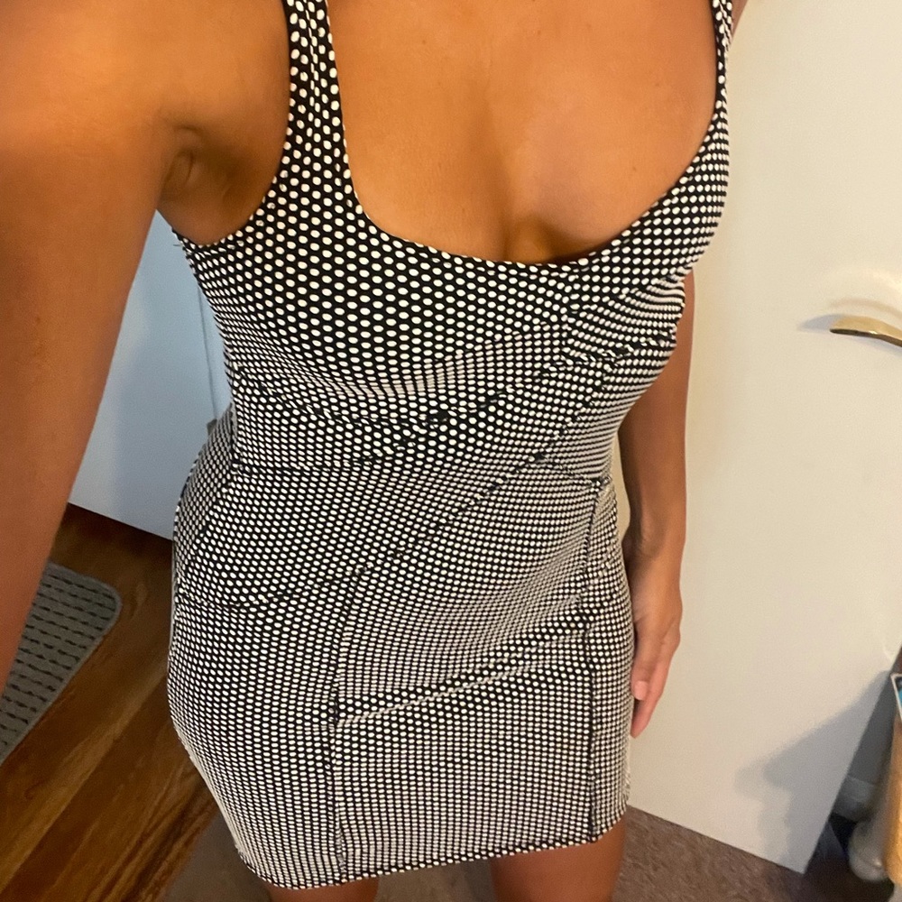Free people black and white polka dot body-con dress. Stretchy fabric. Size xs